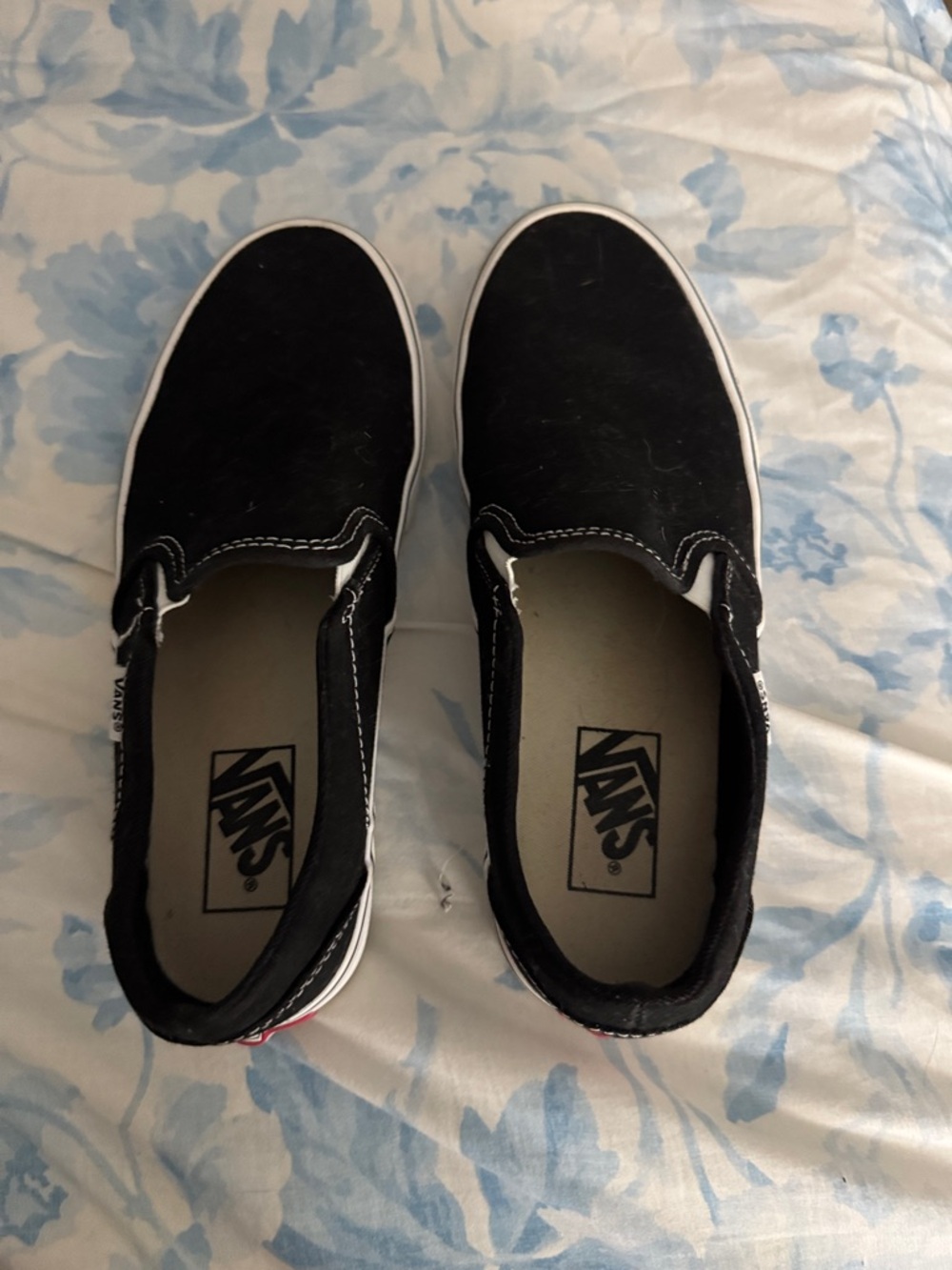 Vans Black and White Slip-On Sneakers